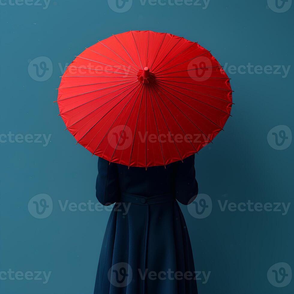 AI generated Girl with red umbrella on blue background with her back turned to the camera. Girl holding umbrella in front of a background. Person under umbrella photo