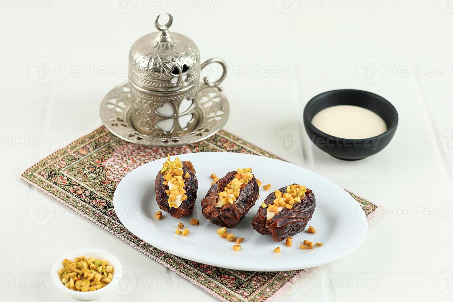 Stuffed Dates with Cream Cheese and Chopped Pistachio Nuts photo