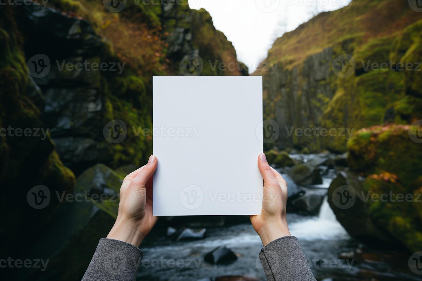 AI generated A person standing in front of a waterfall, holding a card in their hand. photo