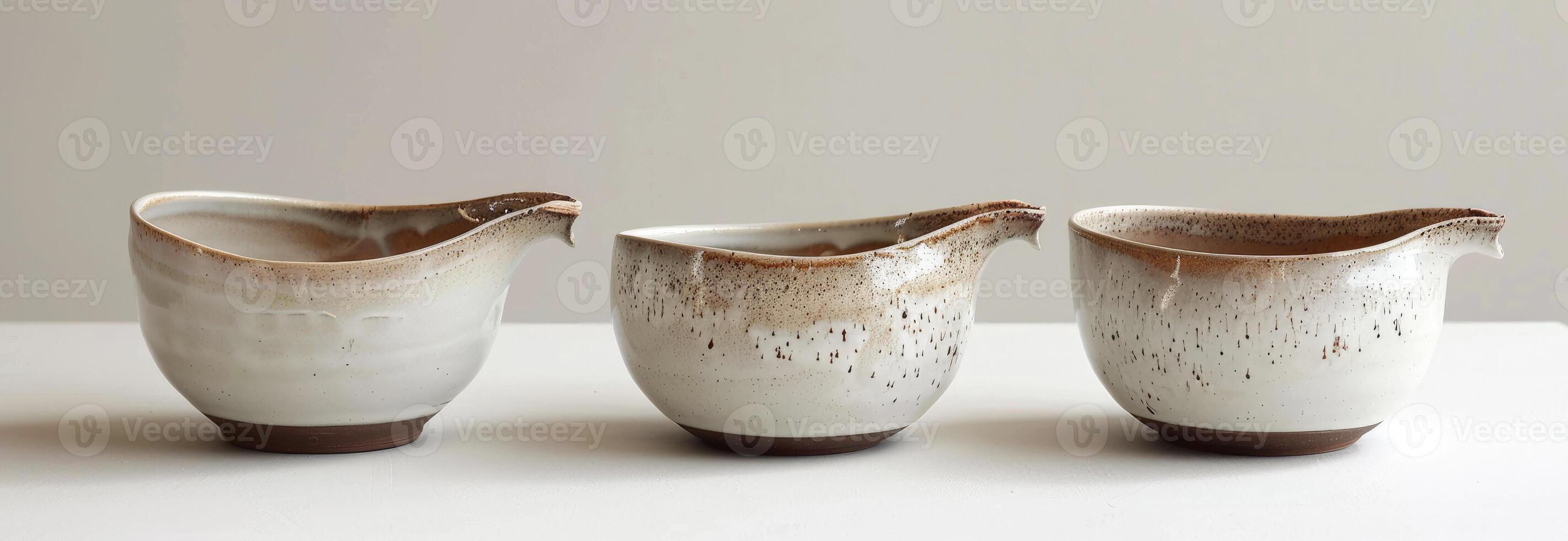 AI generated A set of three white and brown glaze handmade ceramic bowls photo