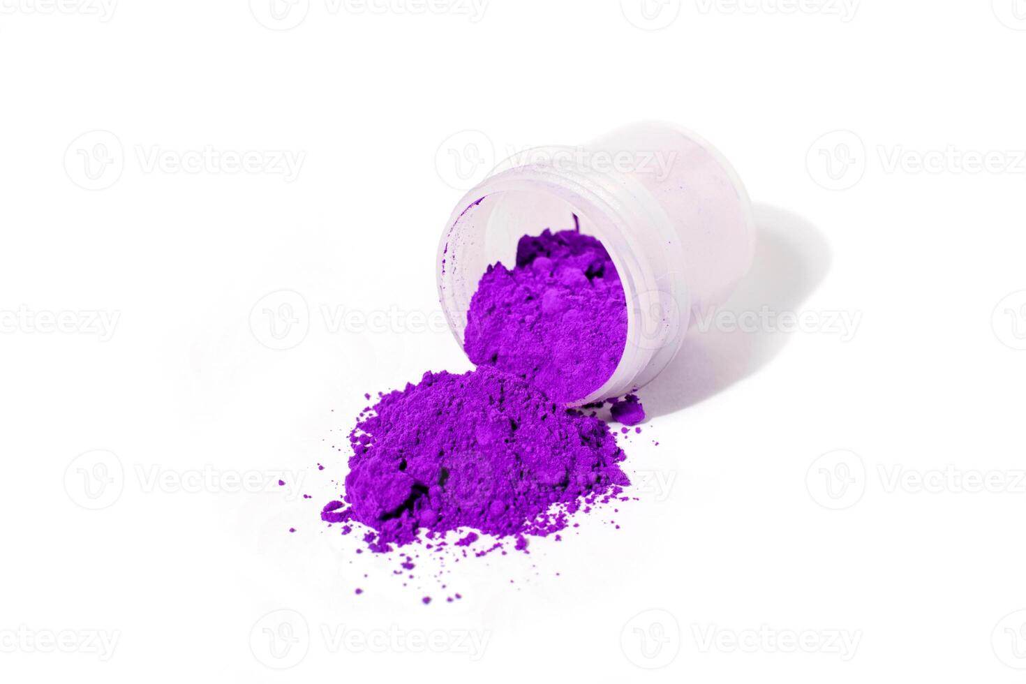 a bunch of dry natural purple pigment on a white background macro photo