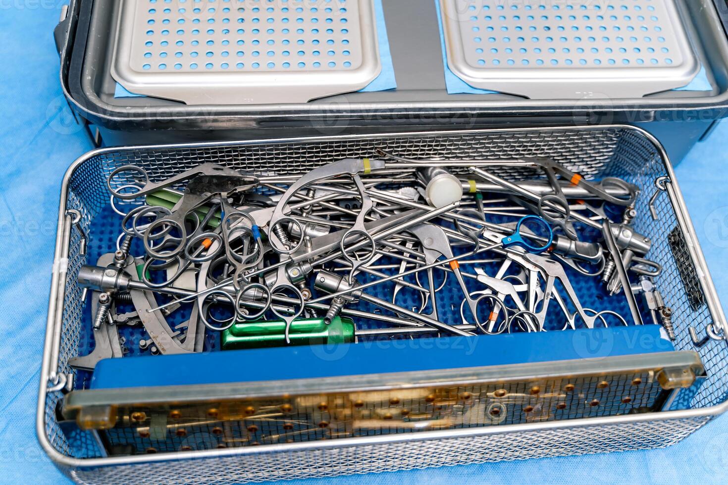 Surgical instruments and tools in the operating room. Operating tools in medical box. Selective focus. photo