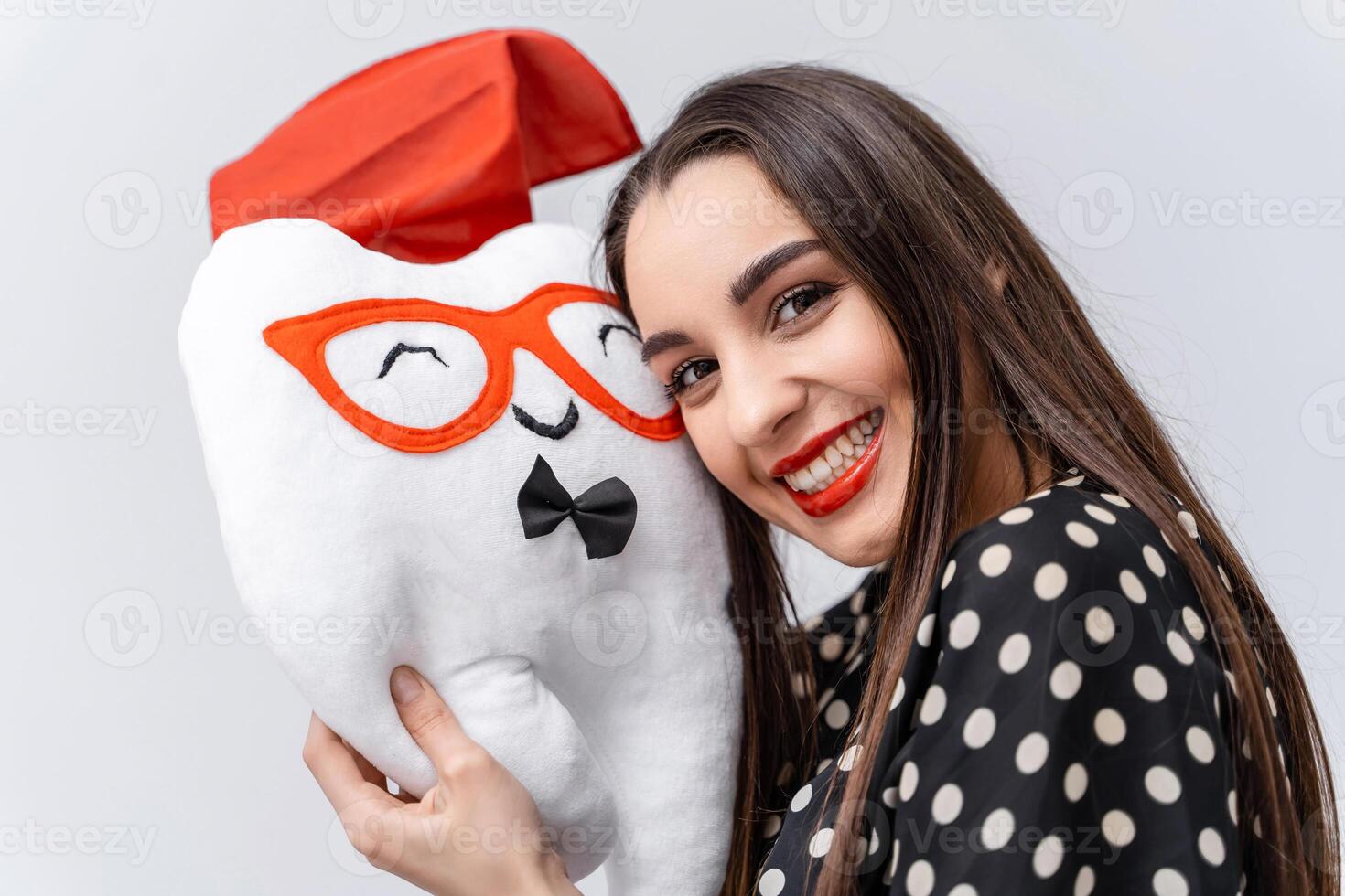 Tooth fairy toy in hands of young beauty. Homemade stuffed toy idea. White background. photo