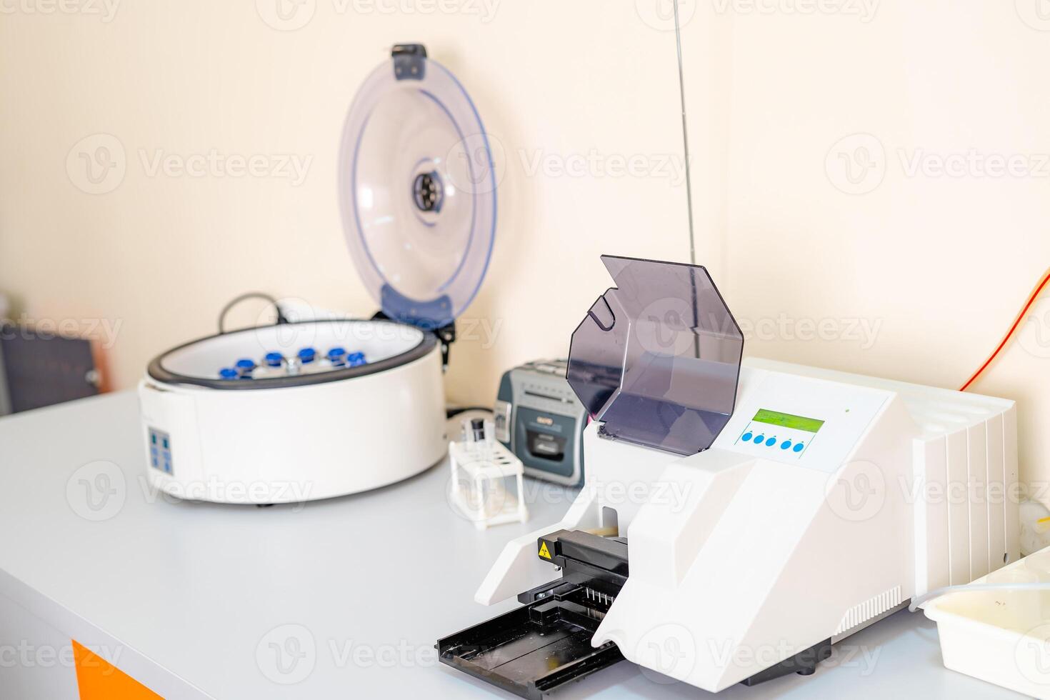 Blood samples for research in microtubes. Testing in laboratory. Centrifuge for blood analyzing. Chemical research. Prevention. photo