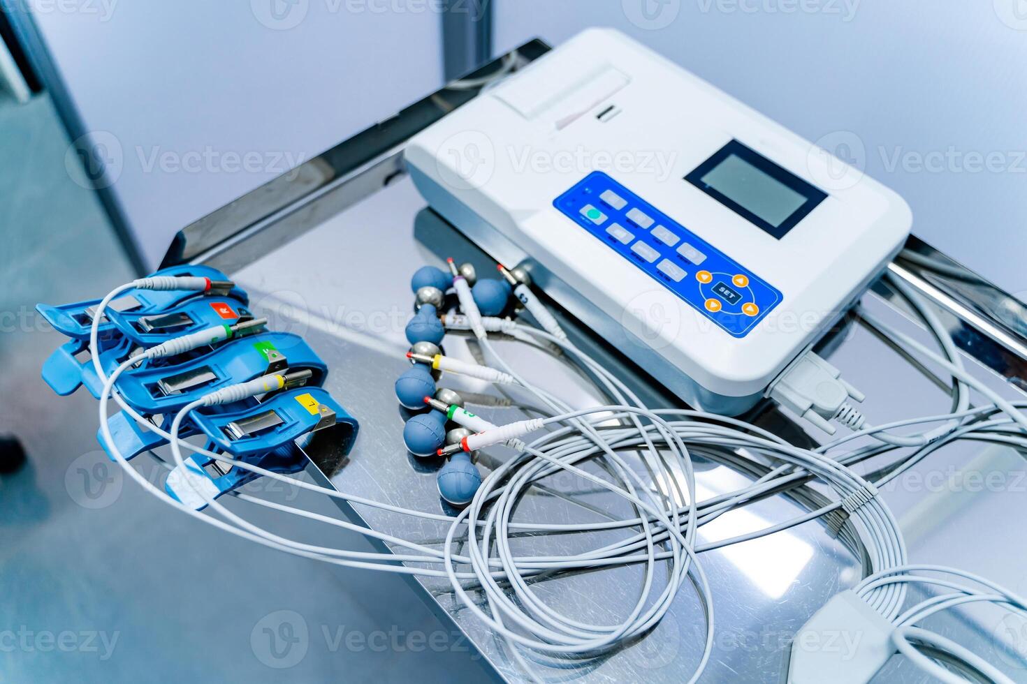 Equipment for electrocardiogram in clinic. Cardiology and medicine concept. ECG in clinic. Medical issues. photo