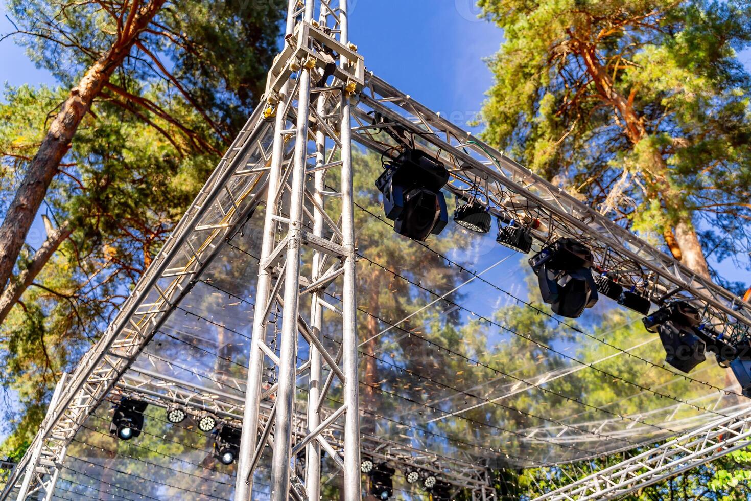 Part of metal structures with lights at height. Concert outdoor. Closeup. photo