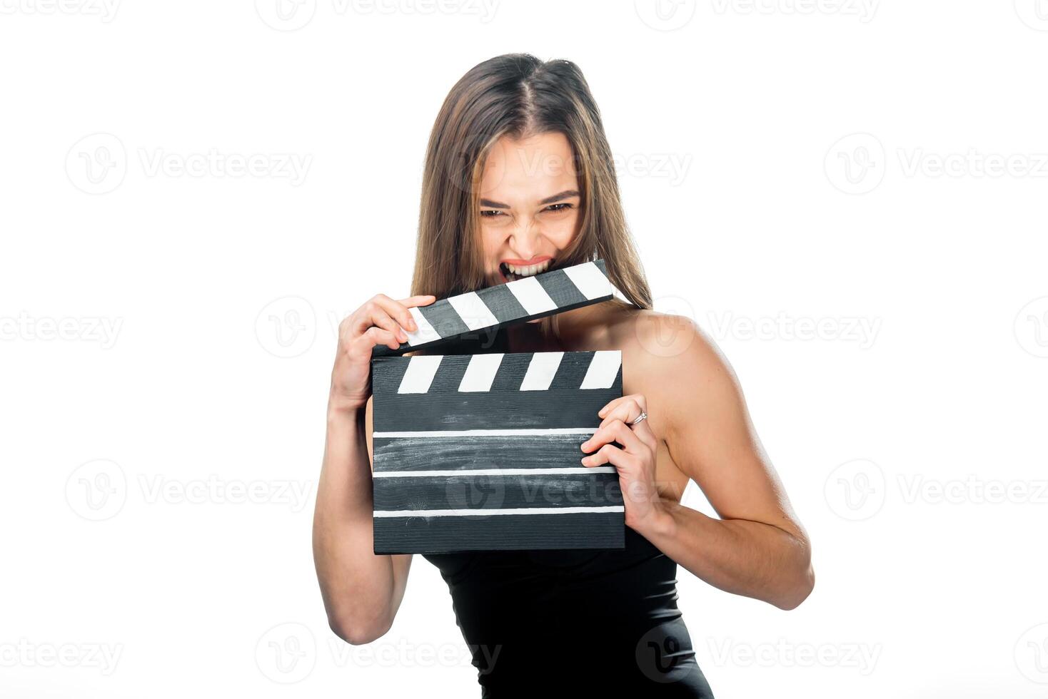 Young girl in red hood with movie board isolated on white photo