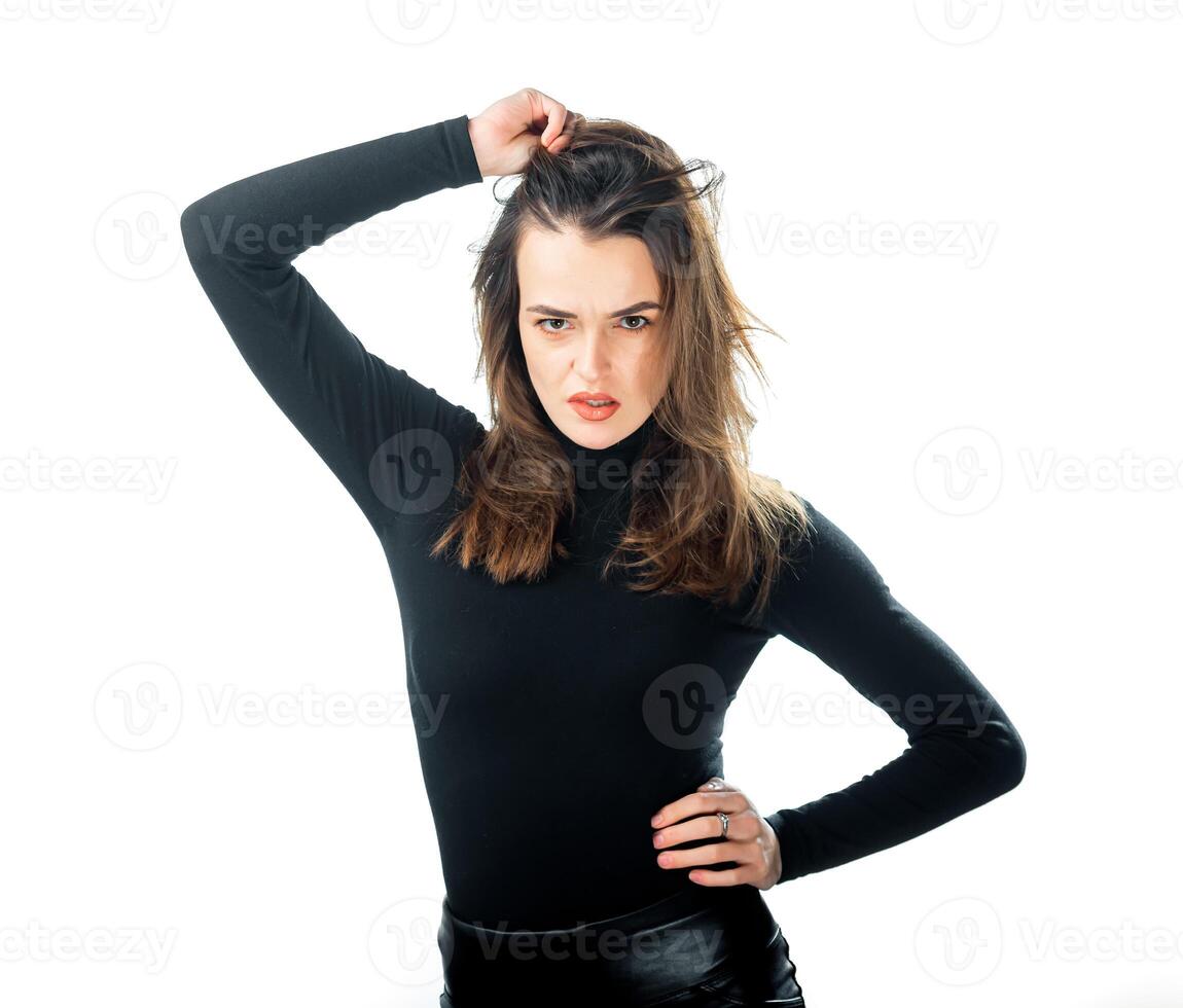 Attractive woman holding hair with hand above head. Happy and funny girl. Isolated white background. photo