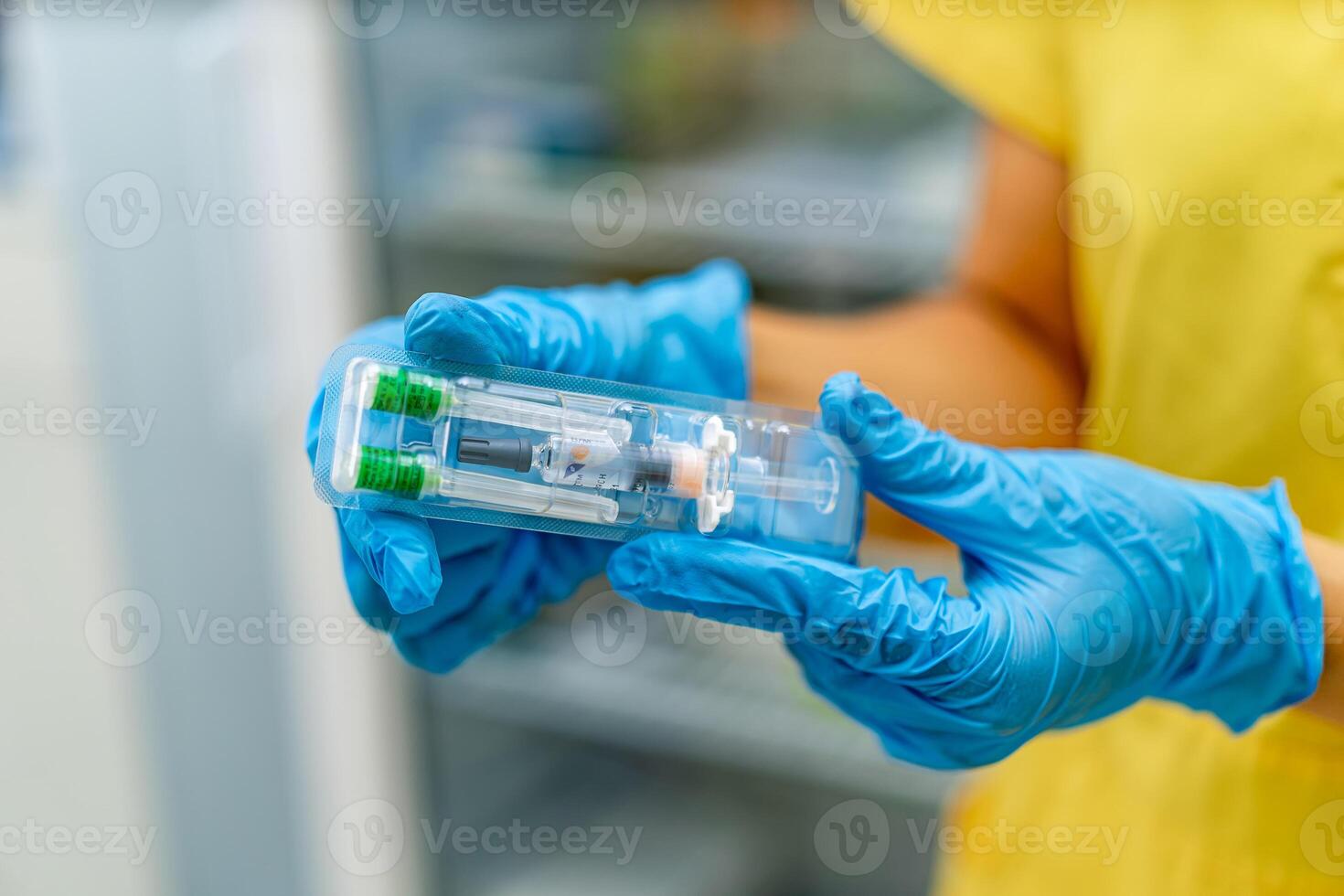 Doctors hands hold vaccination in hands. Selective focus. Prevention, anti-flu concept. Blurred background. photo