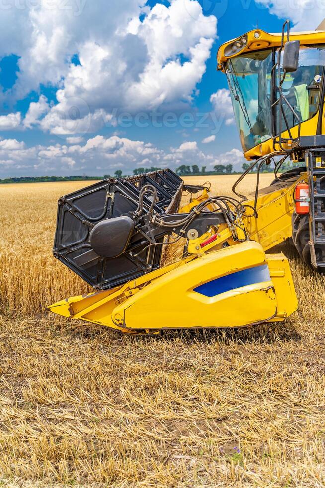 Selective focus on part of harvest gathering machine. Harvest time. Special technic in field. photo