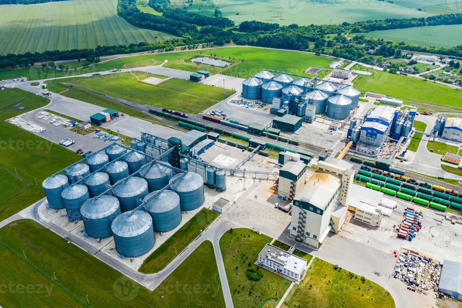 Production of sustainable fuel called bio gas. New factory in field. View from above. Ecological production. photo