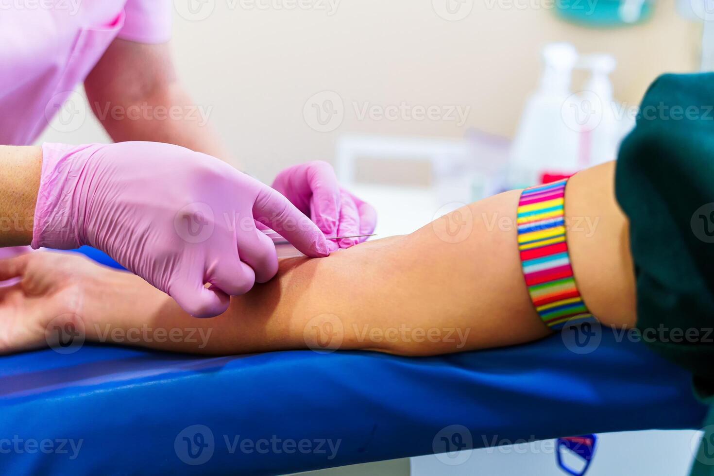 Nurse's hands taking a blood on isolated over laboratory room background. photo