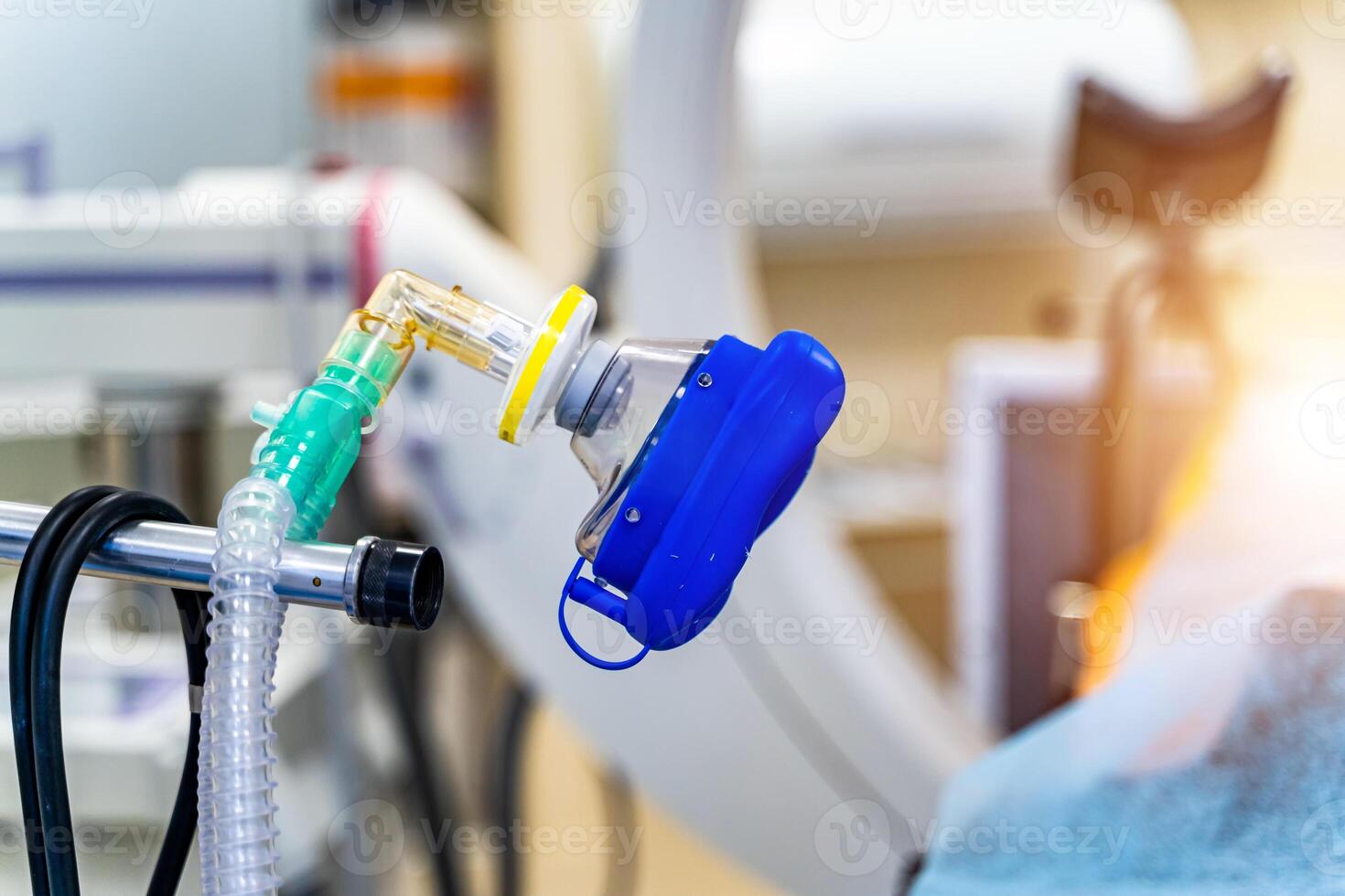 Oxygen mask as part of artificial lungs ventilation machine in surgery room, closeup. Space for text photo