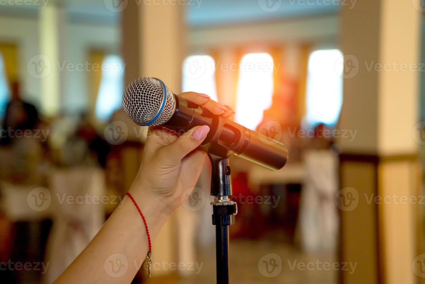 Microphone on stage. Microphone close-up. Microphone. A pub. Bar. A restaurant. Classical. Evening. Night show. Restaurant. photo