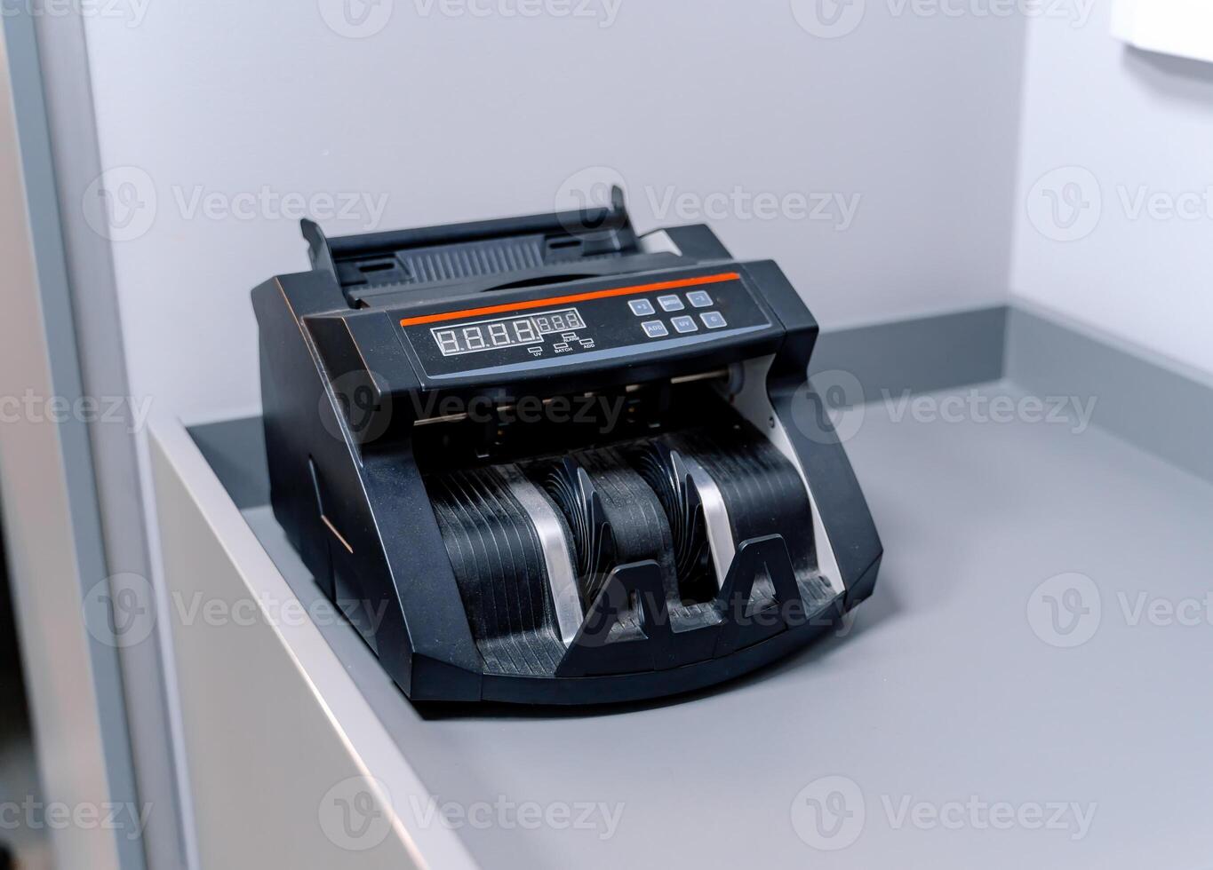Machine for counting money isolated on white. Bancnote counter. Closeup. photo