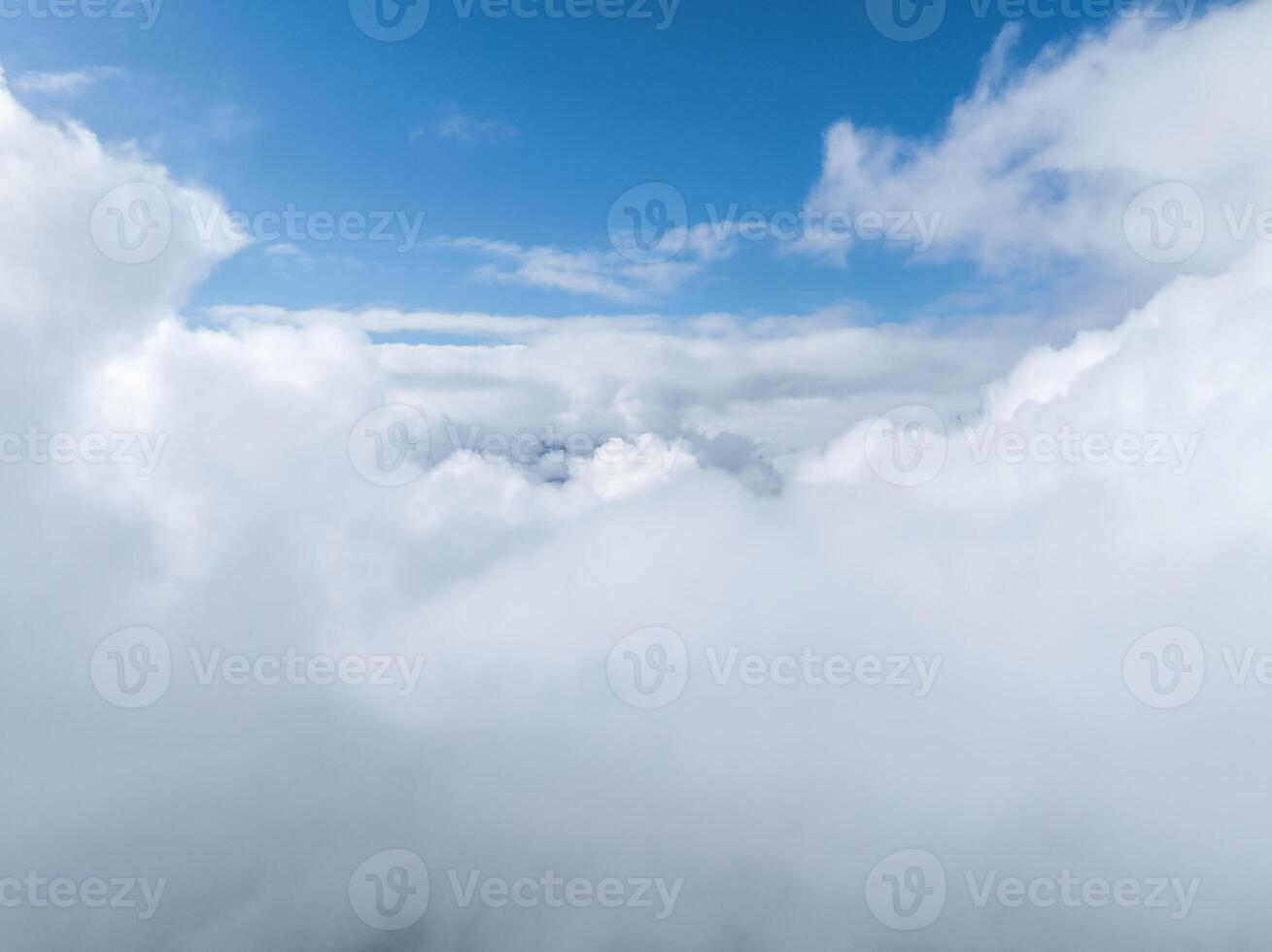 Aerial View of Dense Clouds Above Verbier, Switzerland, on a Clear Day photo