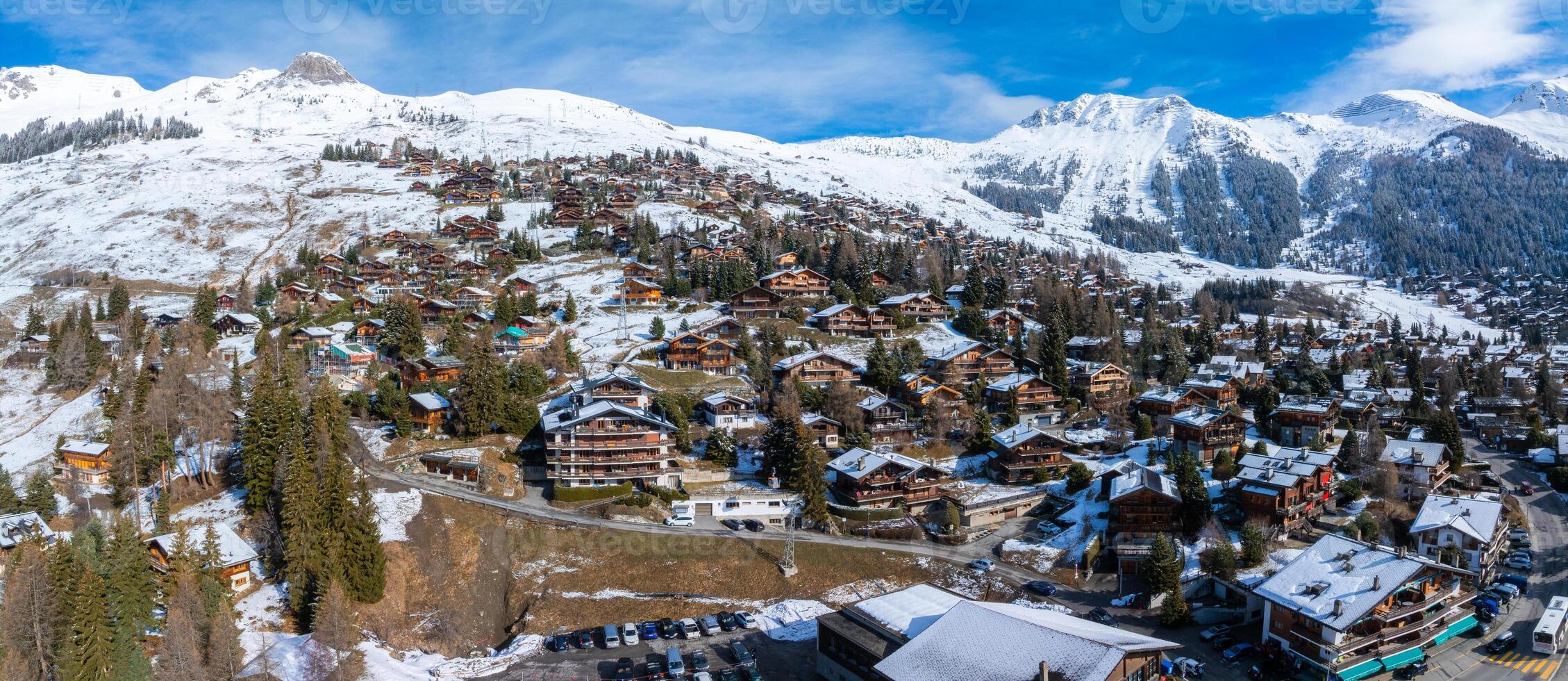 Aerial Panorama of Verbier, Switzerland  Alpine Town in Season Transition photo