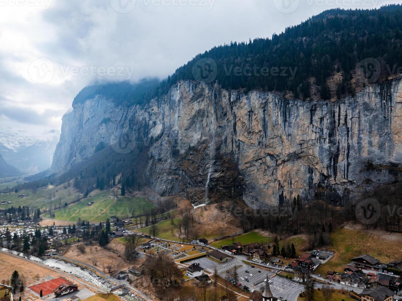 Aerial View of Murren, Switzerland  Alpine Town and Rugged Cliffs photo