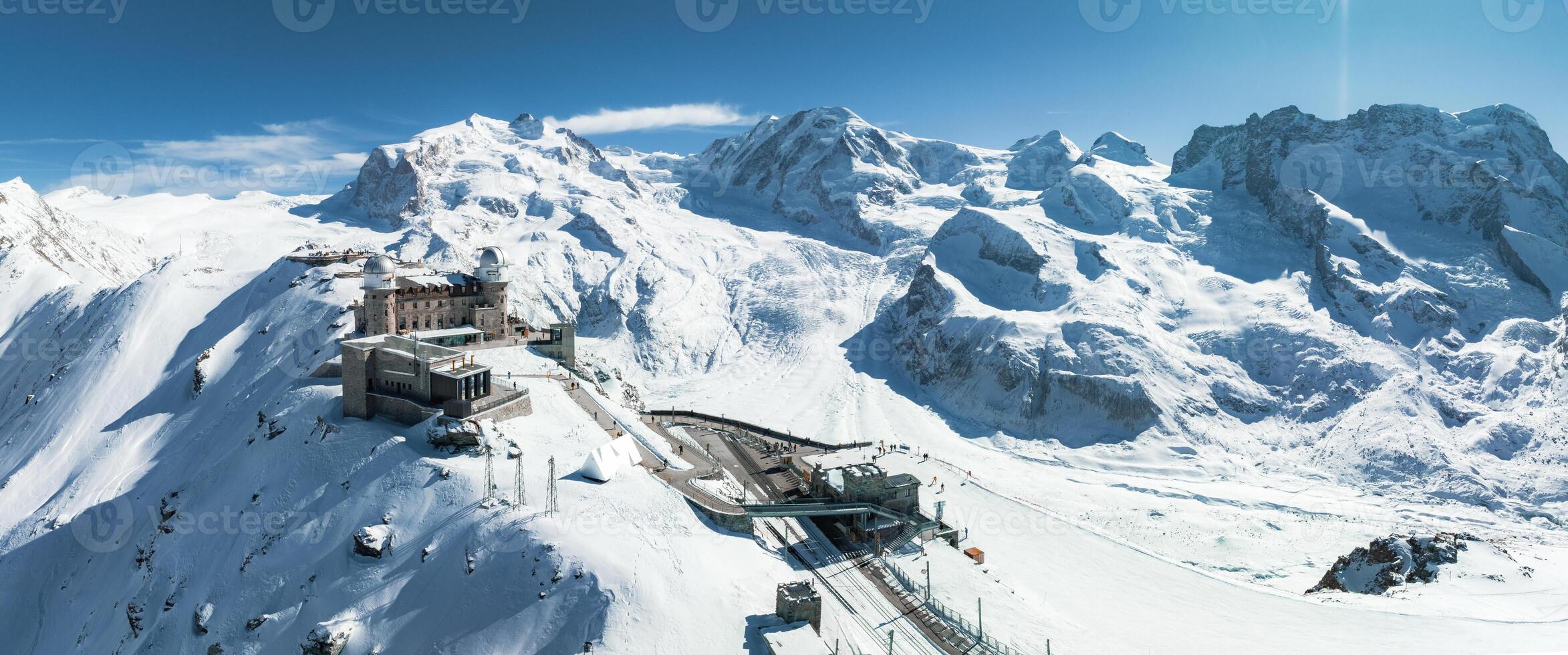 Aerial View of Zermatt Ski Resort with Train, Swiss Alps in Winter photo