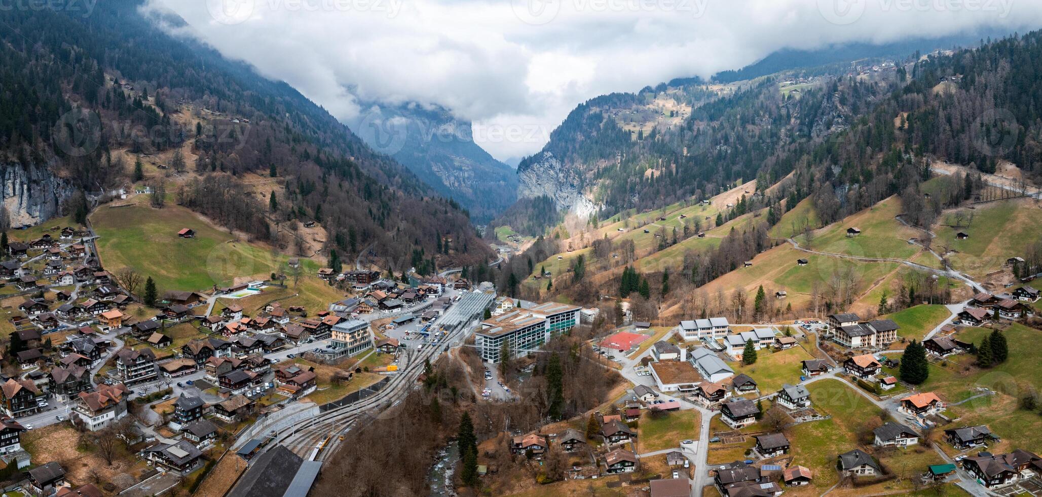 Aerial View of Murren, Switzerland  Alpine Town Amidst Lush Meadows and Mountains photo