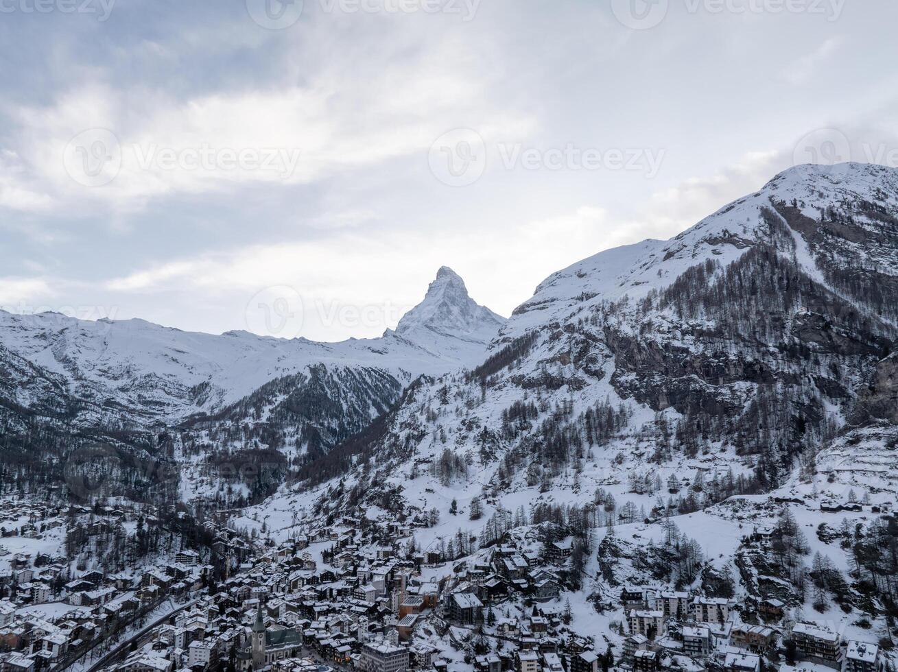 Aerial View of Zermatt, Switzerland with Snowy Matterhorn in Winter photo