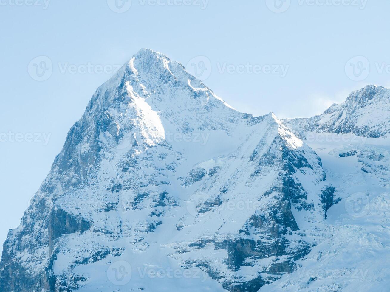 Majestic Snow Covered Mountain Peak at Dawn or Dusk, Murren, Switzerland photo