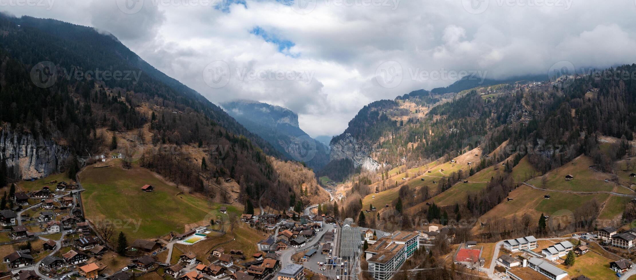 Aerial View of Murren, Switzerland  Alpine Village Amidst Forested Mountains photo