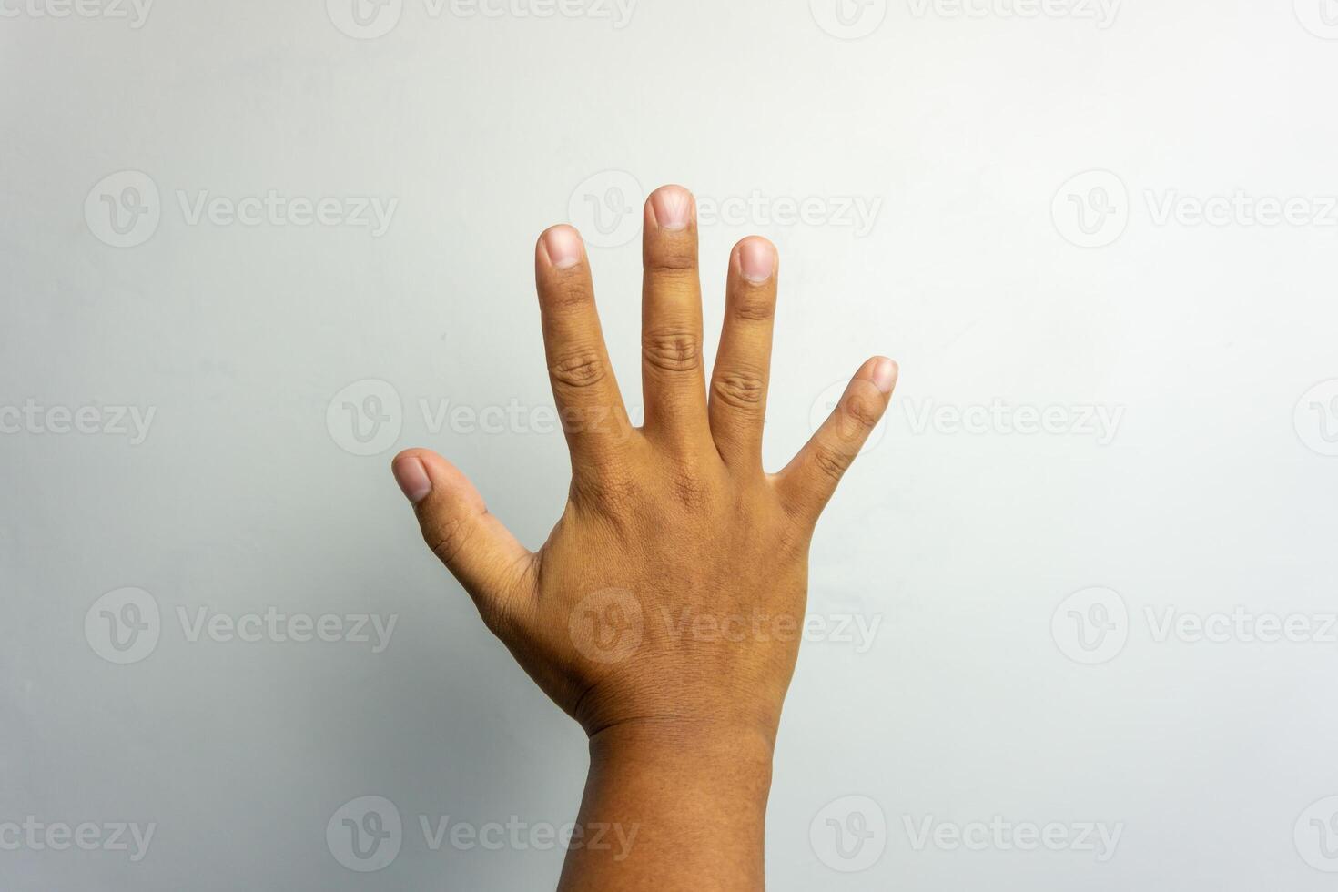 number 5 hand sign isolated on white. bye-bye gesture. man hand number five gesture photo