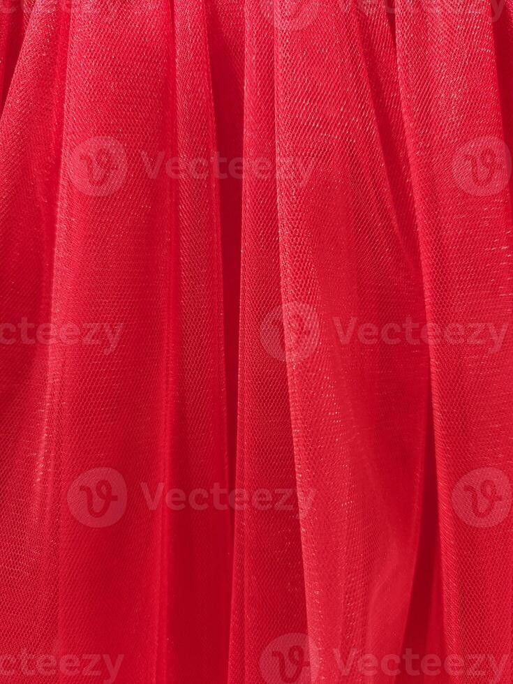 Red mesh fabric. Red fabric background. Factory texture photo