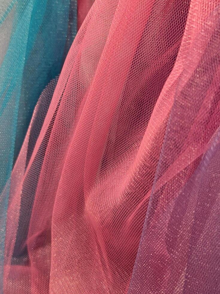 Thin cloth. Thin translucent colored fabric. Fabric background photo