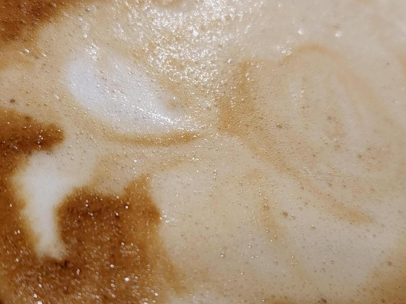 Coffee foam. Texture of coffee foam. Abstract background photo