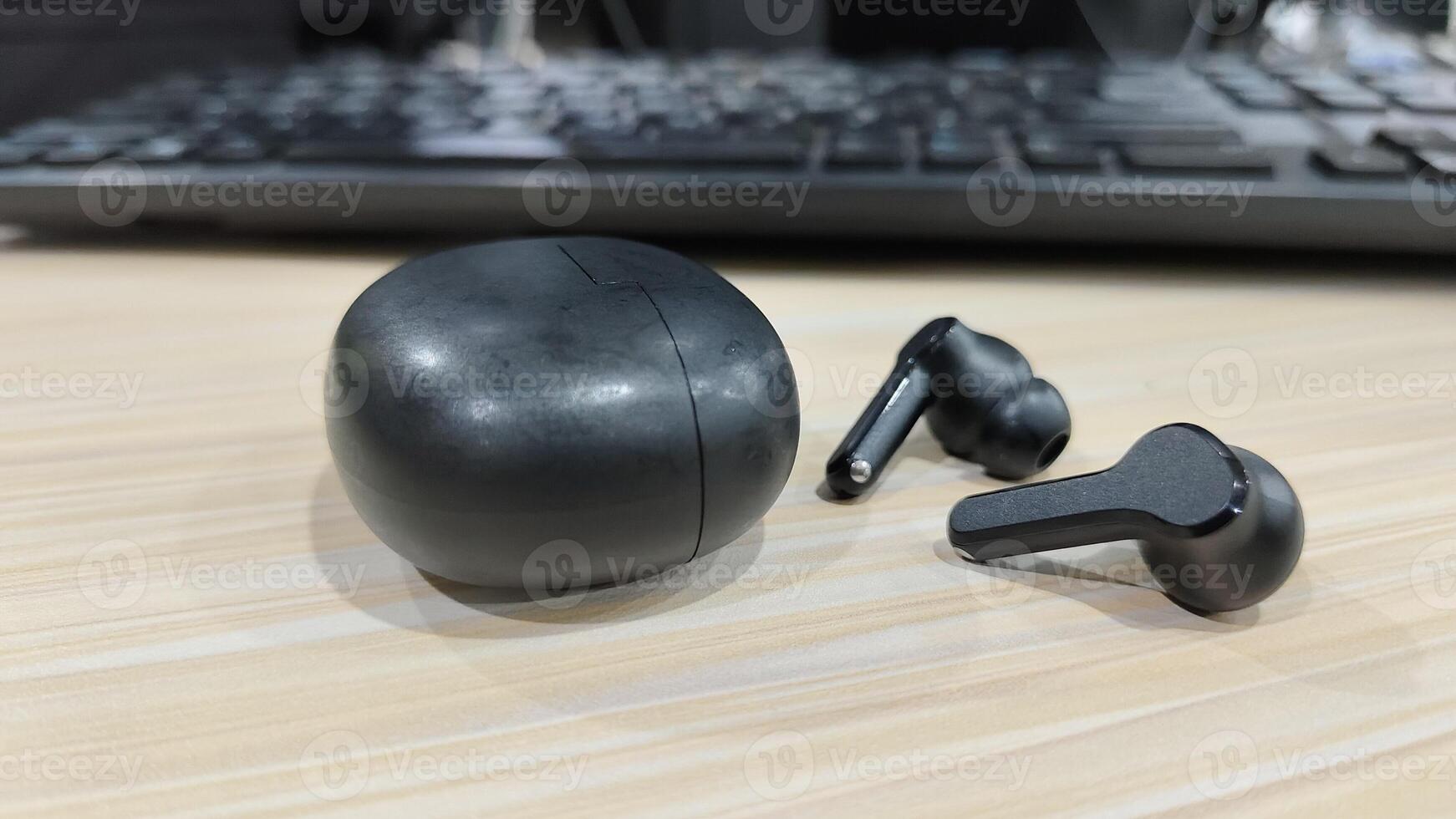 earphones that are on the table that have been used photo