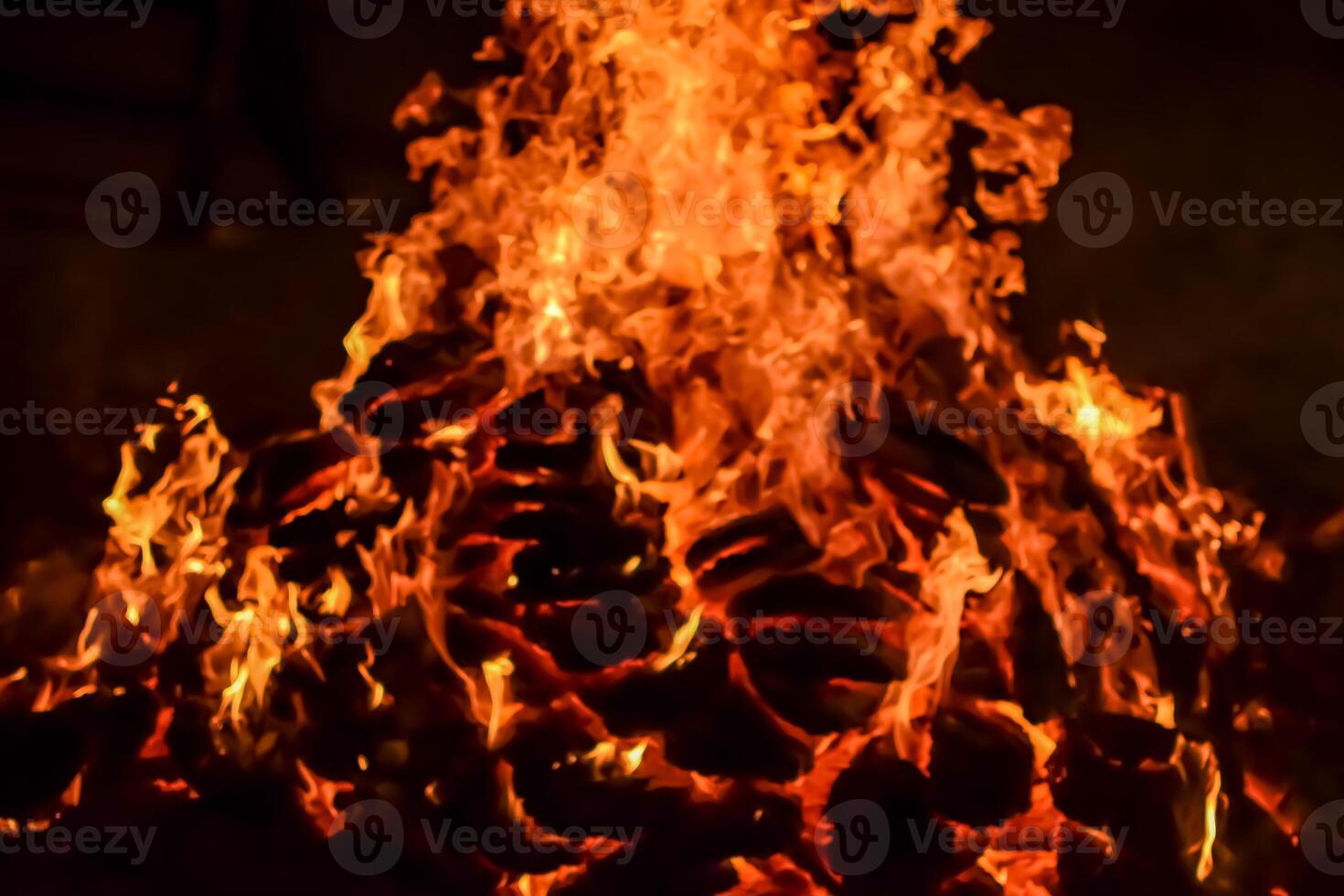 Fire flames on black background, Blaze fire flame texture background, Beautifully, the fire is burning, Fire flames with wood and cow dung bonfire photo