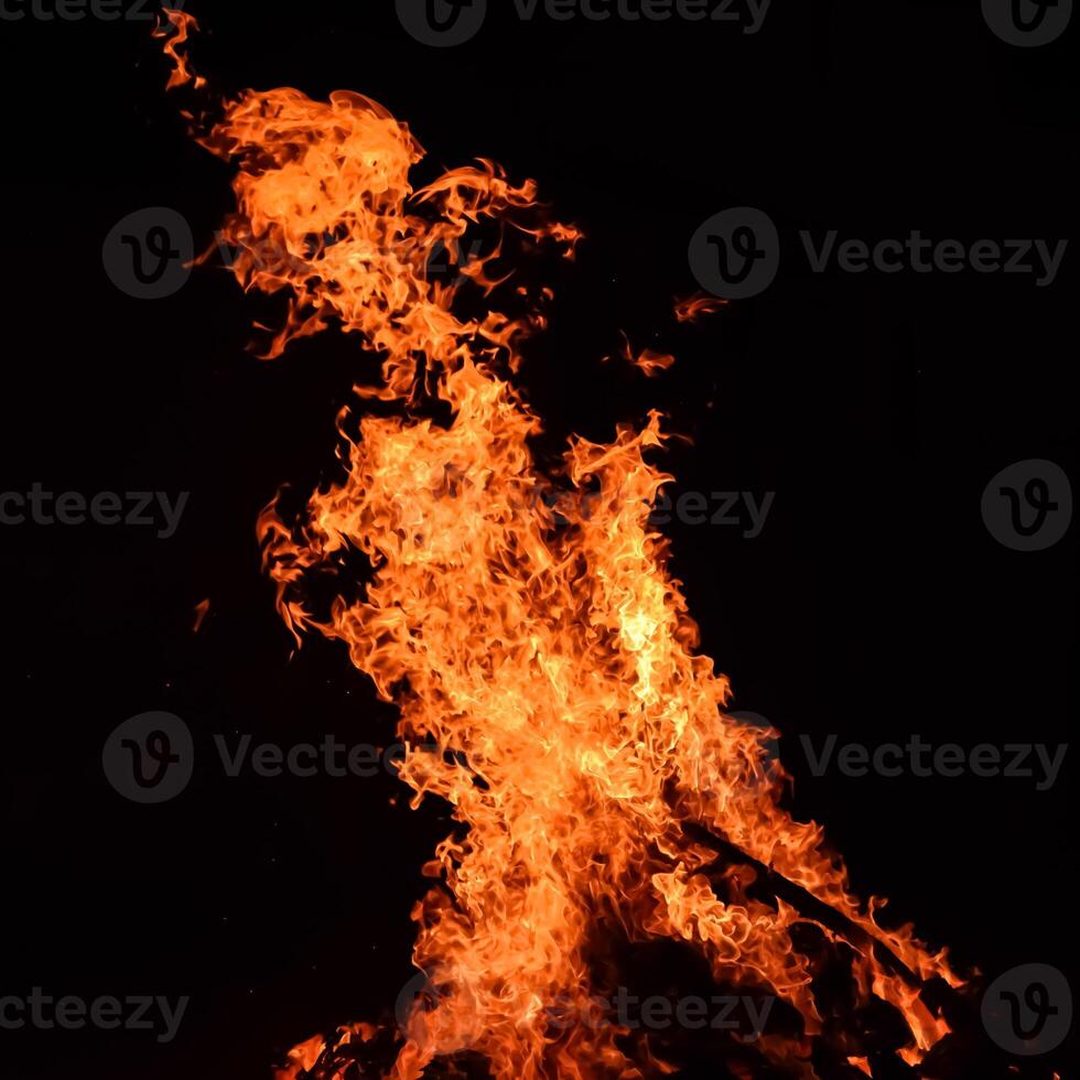 Fire flames on black background, Blaze fire flame texture background, Beautifully, the fire is burning, Fire flames with wood and cow dung bonfire photo