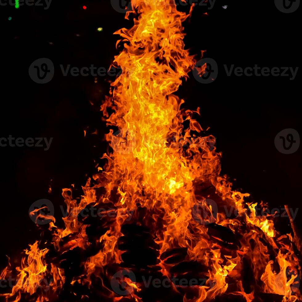 Fire flames on black background, Blaze fire flame texture background, Beautifully, the fire is burning, Fire flames with wood and cow dung bonfire photo