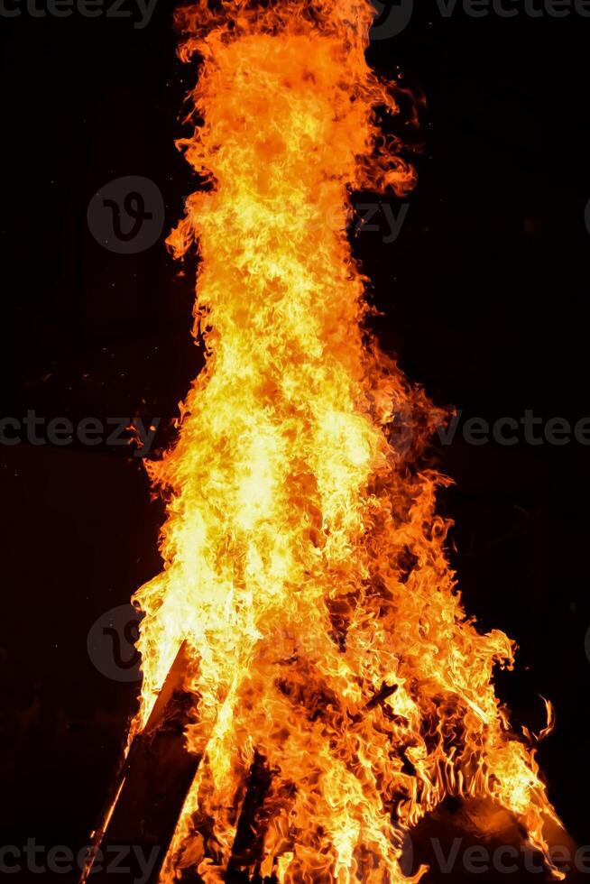 Fire flames on black background, Blaze fire flame texture background, Beautifully, the fire is burning, Fire flames with wood and cow dung bonfire photo