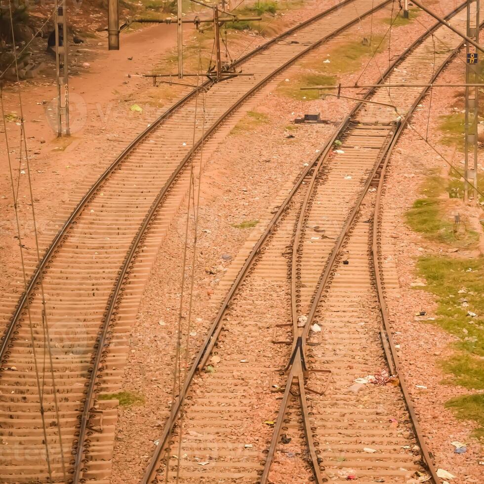View of train Railway Tracks from the middle during daytime at Kathgodam railway station in India, Train railway track view, Indian Railway junction, Heavy industry photo