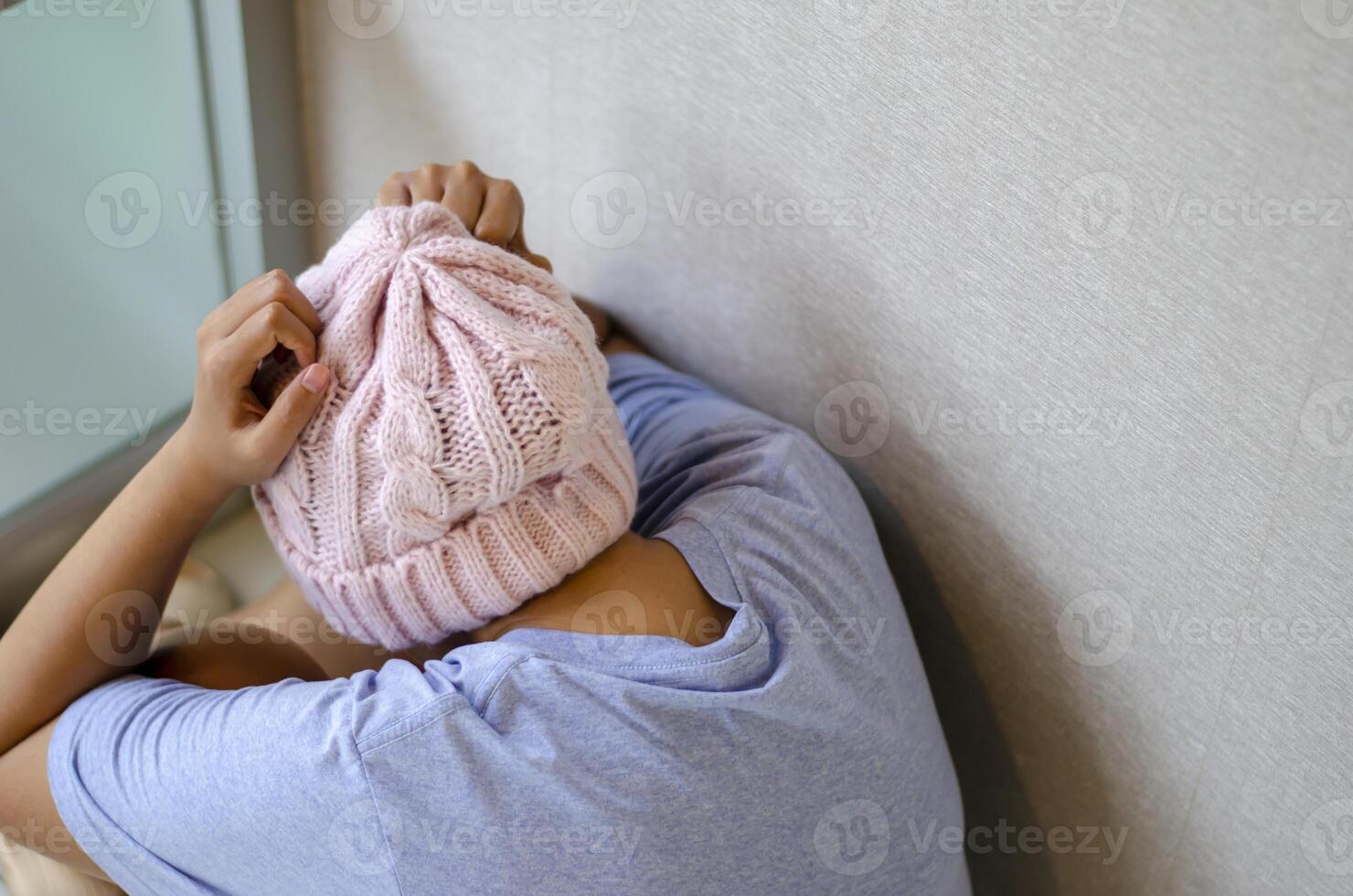 Asian woman has cancer, she is in the corner because she feels stressed and depressed. photo