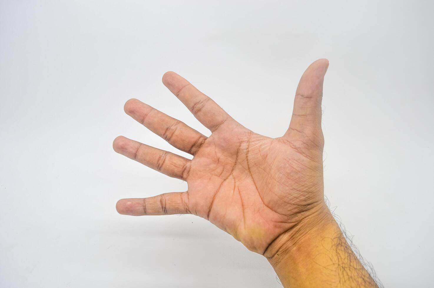 open palm gesture forming the number five photo