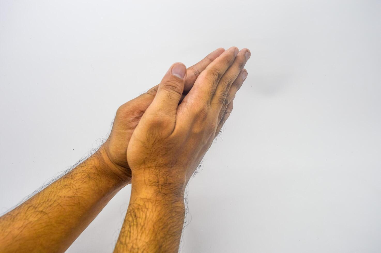 a hand gesture of apologizing or shaking hands or greetings photo