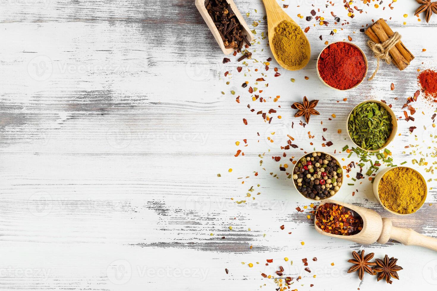 Top view of various spices in bowls isolated on white background. Copy space. photo