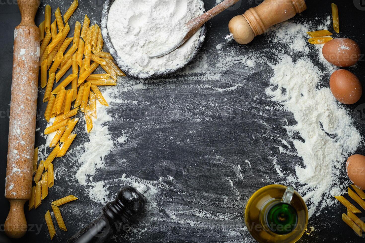 Baking background with egg, pasta, penne and rolling pin. Copy space photo