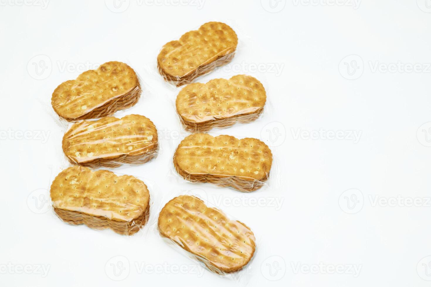 Delicious sweet cookies in a protective cellophane package for sale on a white photo