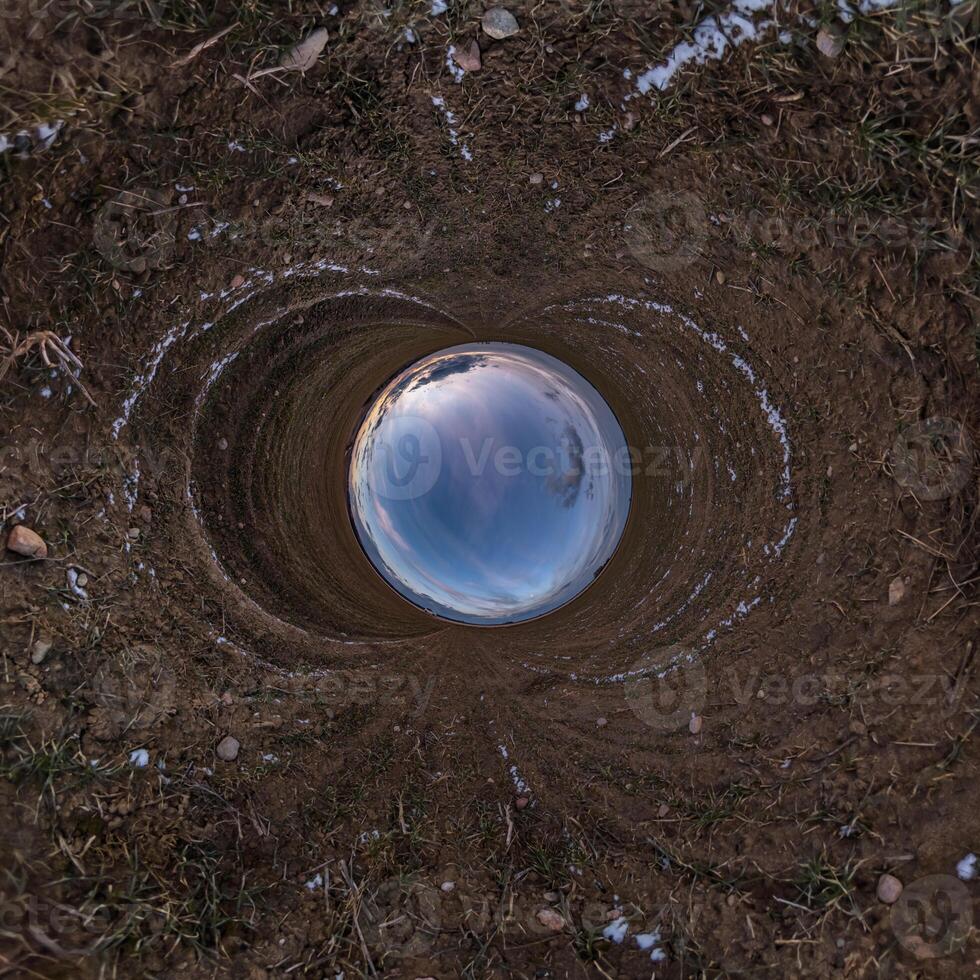 blue hole sphere little planet inside sand or dry grass round frame background photo