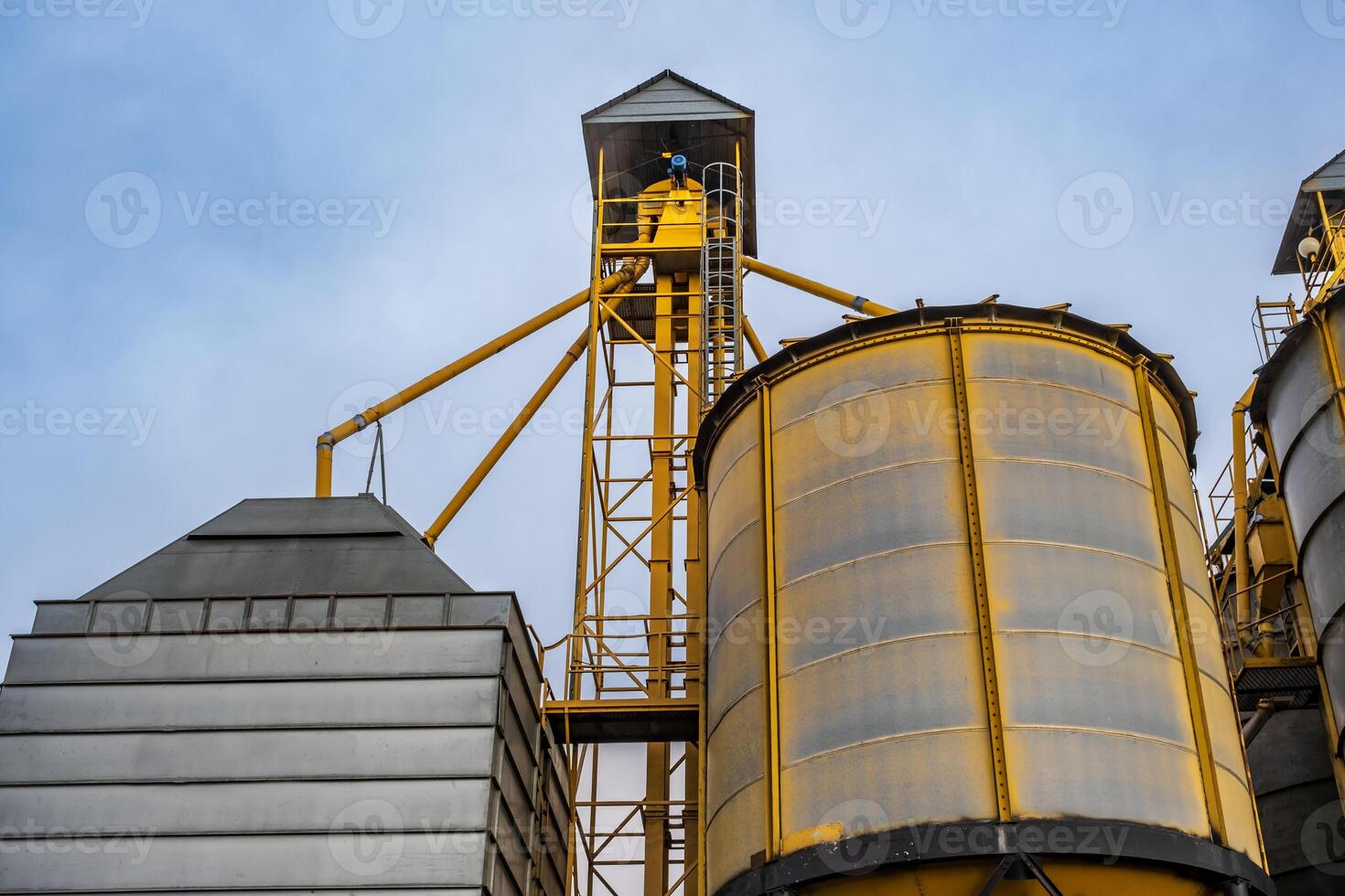 silos on agro-industrial complex with seed cleaning and drying line for grain storage photo