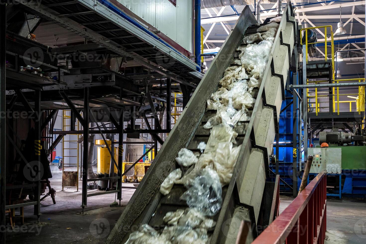 moving conveyor transporter on Modern waste recycling processing plant. Separate and sorting garbage collection. Recycling and storage of waste for further disposal. photo