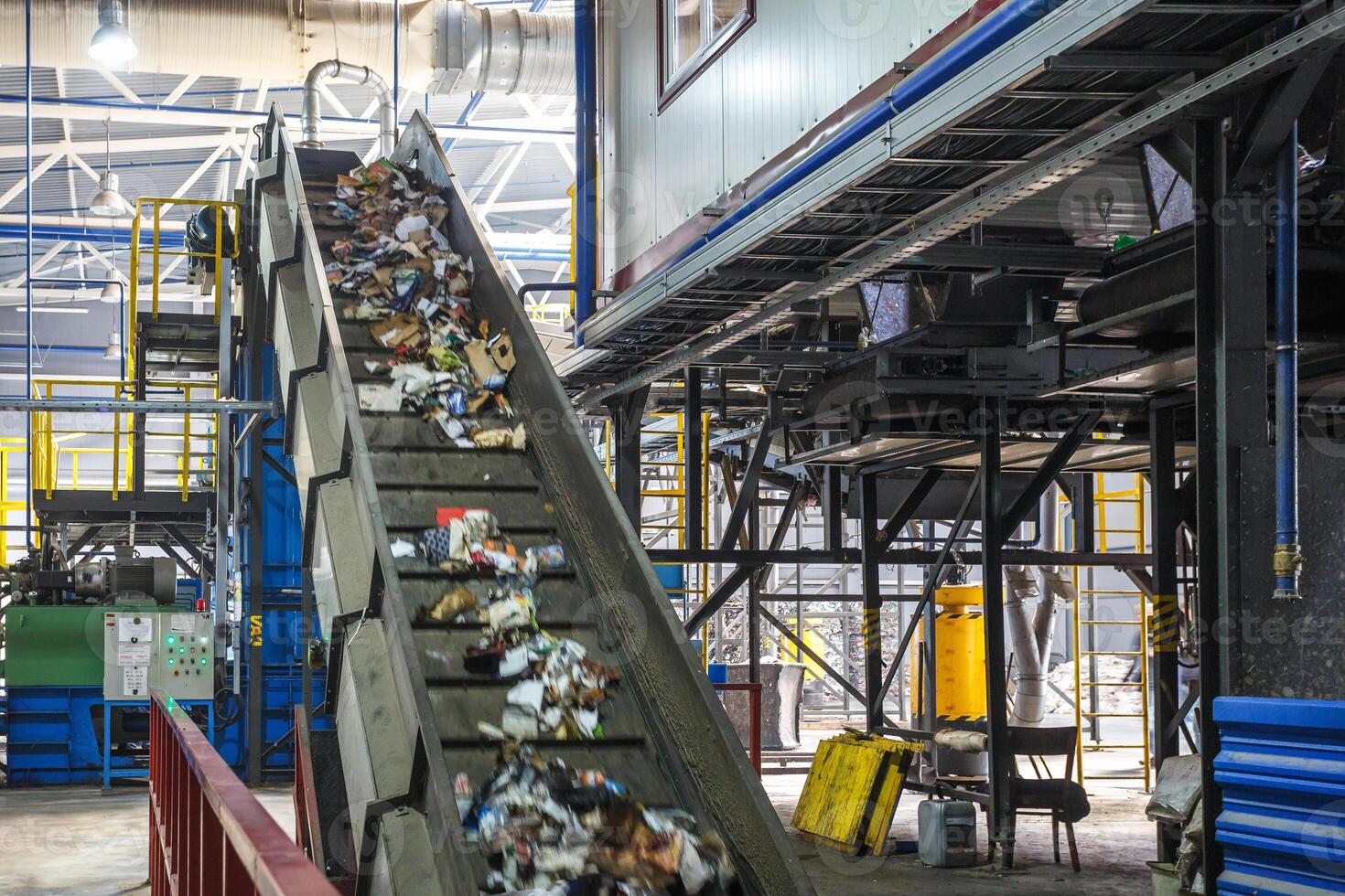 moving conveyor transporter on Modern waste recycling processing plant. Separate and sorting garbage collection. Recycling and storage of waste for further disposal. photo