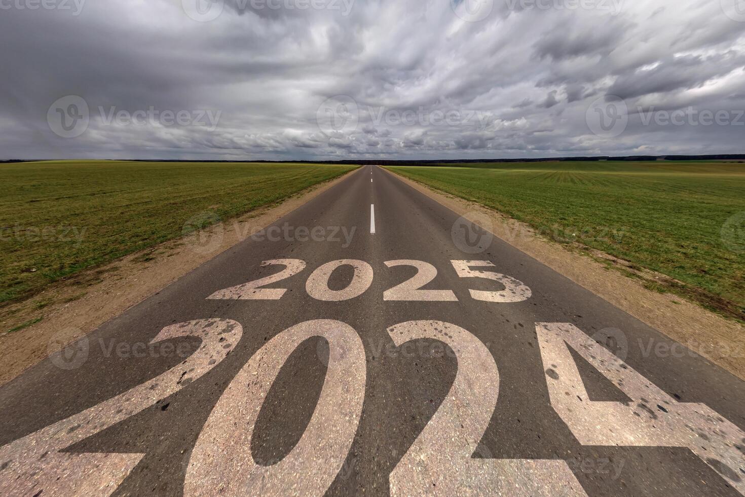 signs 2024, 2025 on asphalt road highway with overcast sky background. concept of destination or uncertainty in future, freedom, work start, run, planning, challenge, target, new year photo