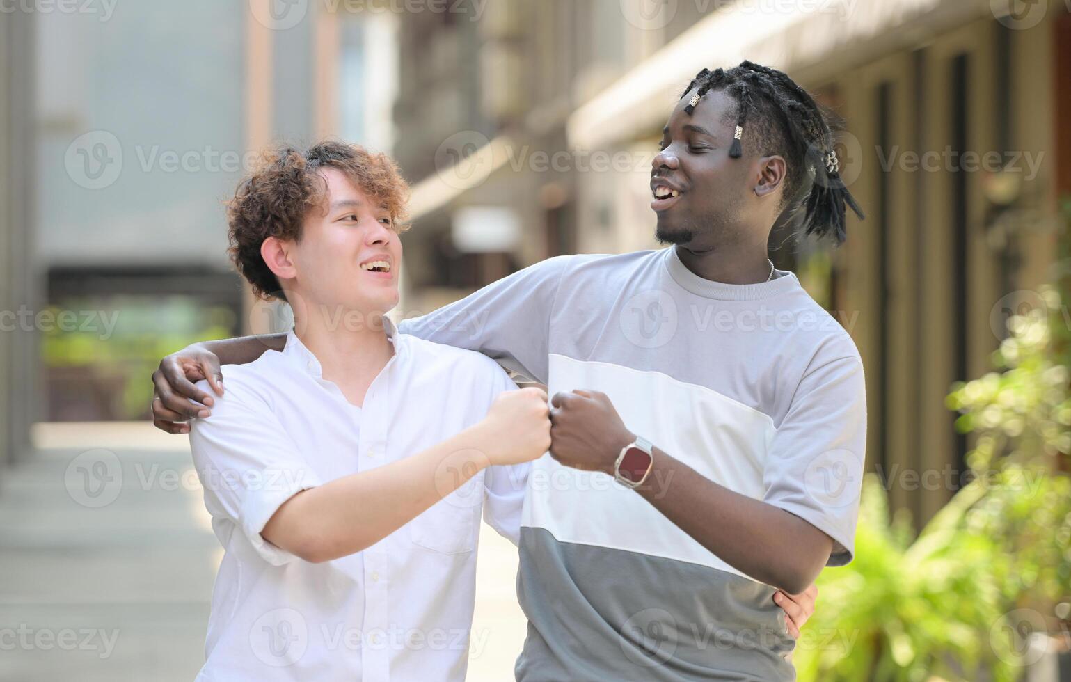 Young multiethnic friend having fun outdoors on beautiful summer day photo