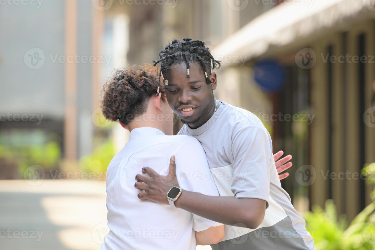 Young multiethnic friend having fun outdoors on beautiful summer day photo